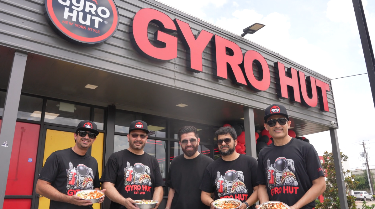 Gyro Hut team in front of a New York-style storefront