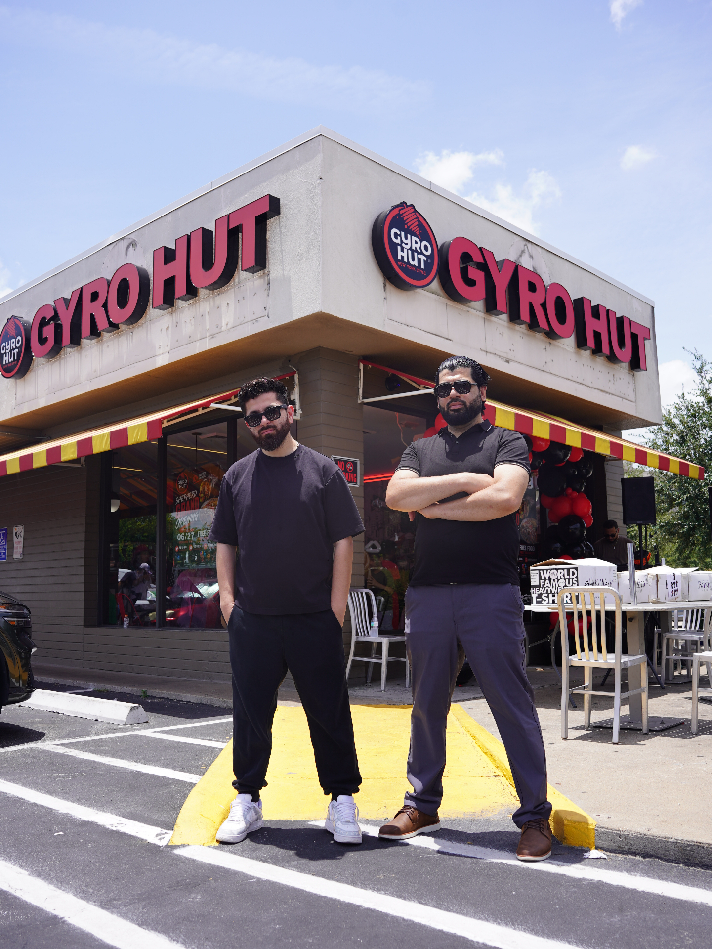 Gyro Hut founders in front of the store